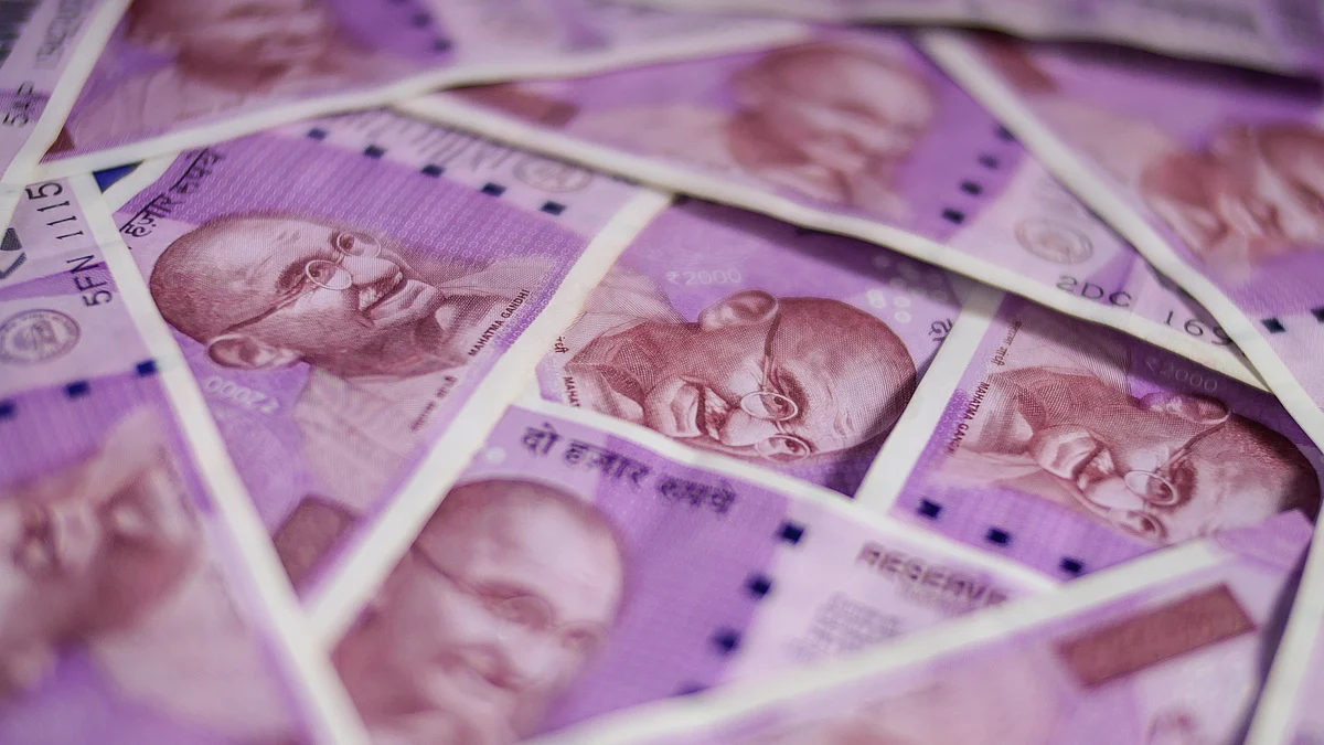 Two thousand rupee banknotes are arranged for a photograph. (Photographer: Dhiraj Singh/Bloomberg News)