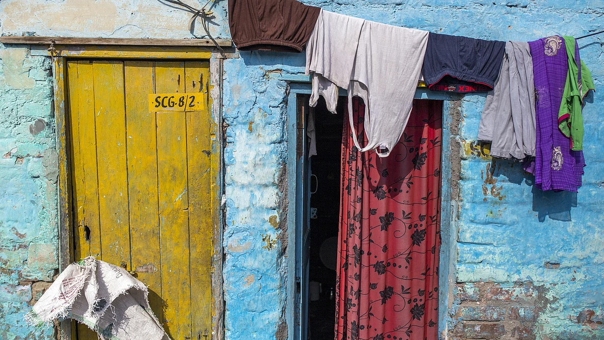 Laundry hangs from a line in a slum area of New Delhi, India. (Photographer: Prashanth Vishwanathan/Bloomberg)