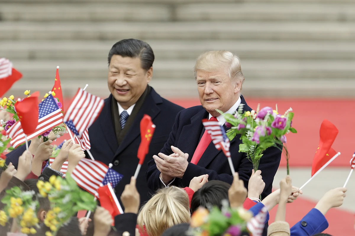 U.S. President Donald Trump, right, and Xi Jinping, China’s president, greet attendees outside the Great Hall of the People in Beijing, China, on Nov. 9, 2017. (Photographer: Qilai Shen/Bloomberg)