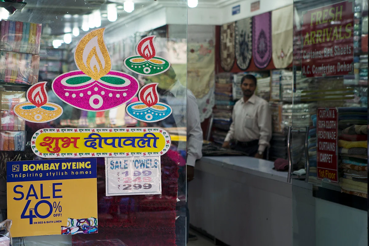 Shops display discount offers prior to Diwali at Sarojini Market, in New Delhi, India. (Prashanth Vishwanathan/Bloomberg News)