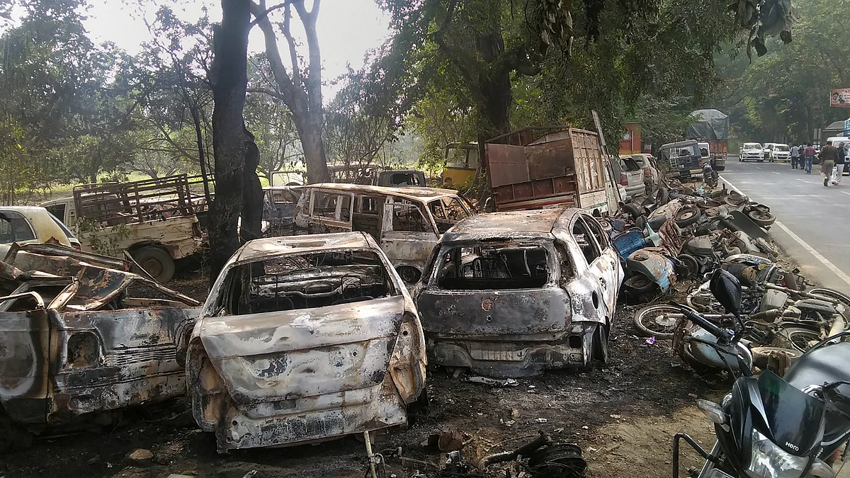 Charred vehicles which were set on fire by a mob in violent clashes on Dec. 3, over the alleged illegal slaughter of cattle in Bulandshahr, Uttar Pradesh. (Photograph: PTI)