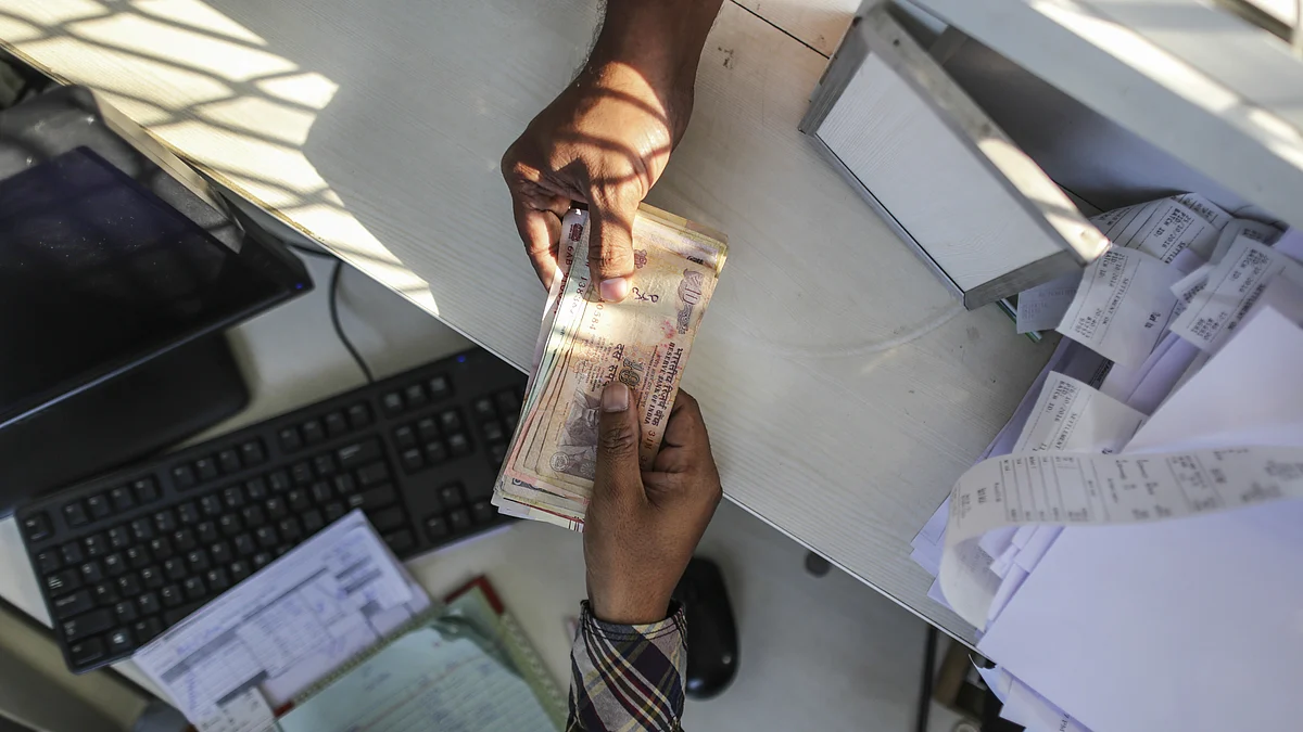 India rupee banknotes at a cash counter (Photographer: Dhiraj Singh/Bloomberg) 
