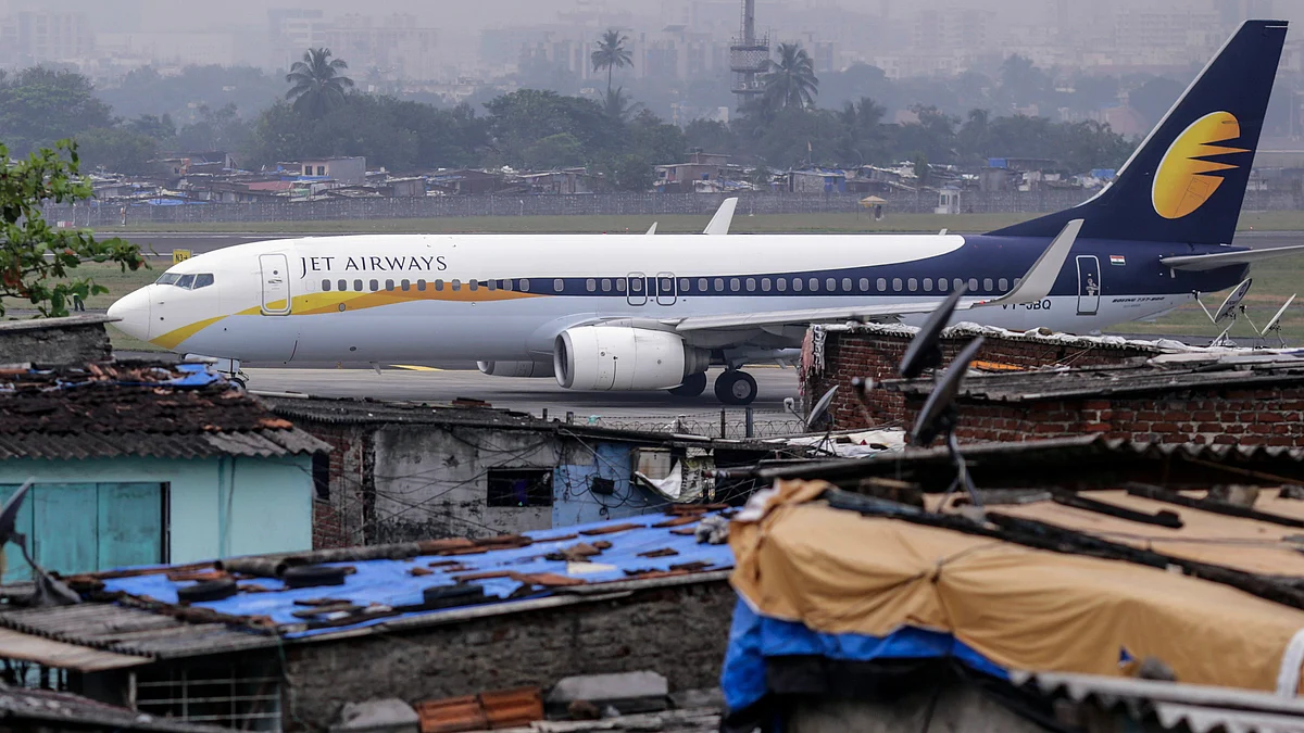 A Boeing Co. 737 aircraft operated by Jet Airways India Ltd. taxies at Chhatrapati Shivaji International Airport in Mumbai, India. (Photographer: Dhiraj Singh/Bloomberg)