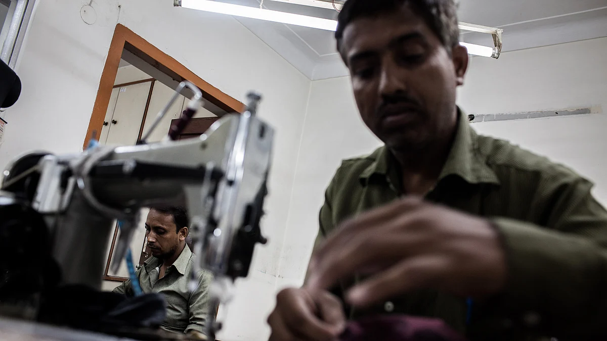 Tailors work at fashion designer Anjana Das’ workshop in Shahpur Jat village in New Delhi, India. (Photographer: Sanjit Das/Bloomberg)