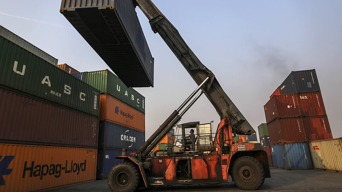 A reach stacker moves a shipping container at the Jawaharlal Nehru Port, operated by Jawaharlal Nehru Port Trust (JNPT), in Navi Mumbai, Maharashtra, India. (Photographer: Dhiraj Singh/Bloomberg)