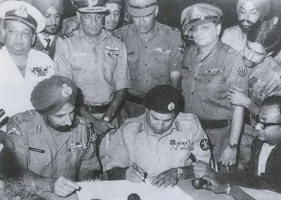 Pakistan’s Lt. Gen. AAK Niazi signing the Instrument of Surrender, while India’s Lt. Gen. JS Aurora looks on, in Dhaka, on Dec. 16, 1971. (Photograph: Indian Navy)