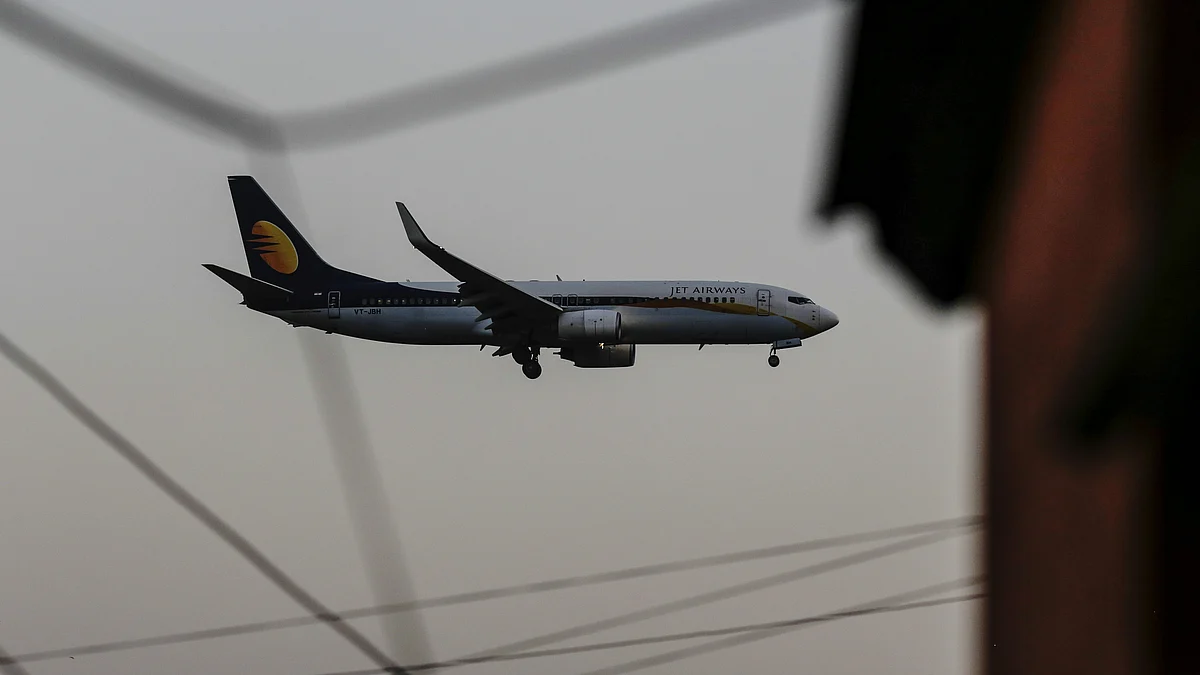 A Jet Airways India Ltd. plane prepares to land at Chhatrapati Shivaji International Airport in Mumbai, India. (Photographer: Dhiraj Singh/Bloomberg)