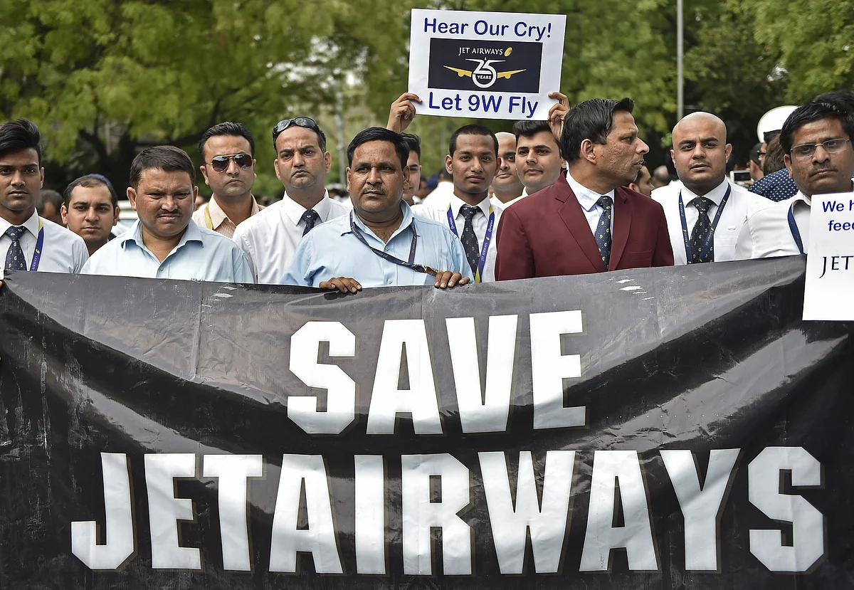 Cabin crew hold placards during a protest organized by Jet Airways India Ltd. employees at Jantar Mantar in Delhi, India (Photographer: Anindito Mukherjee/Bloomberg) 