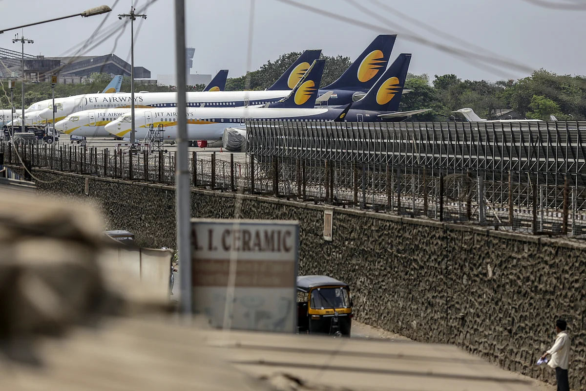 Grounded Jet Airways India Ltd. aircraft. (Photographer: Dhiraj Singh/Bloomberg) 