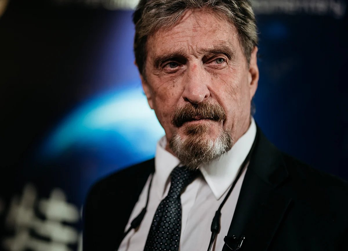 John McAfee Vows to Unmask Crypto’s Satoshi Nakamoto, Then Backs Off