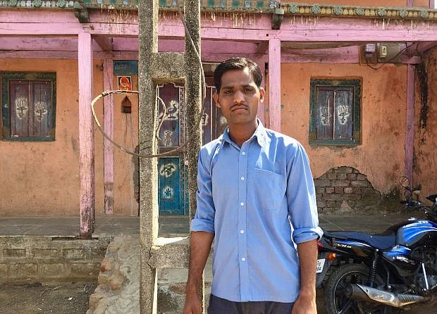 Mohan Kankate, 23, and a resident of Pimplad, a village in Nashik district in northwestern Maharashtra, says only about 20% of the men in his village are employed. Most others spend their days drinking alcohol and playing cards. (Photographer: Tish Sanghera, IndiaSpend)