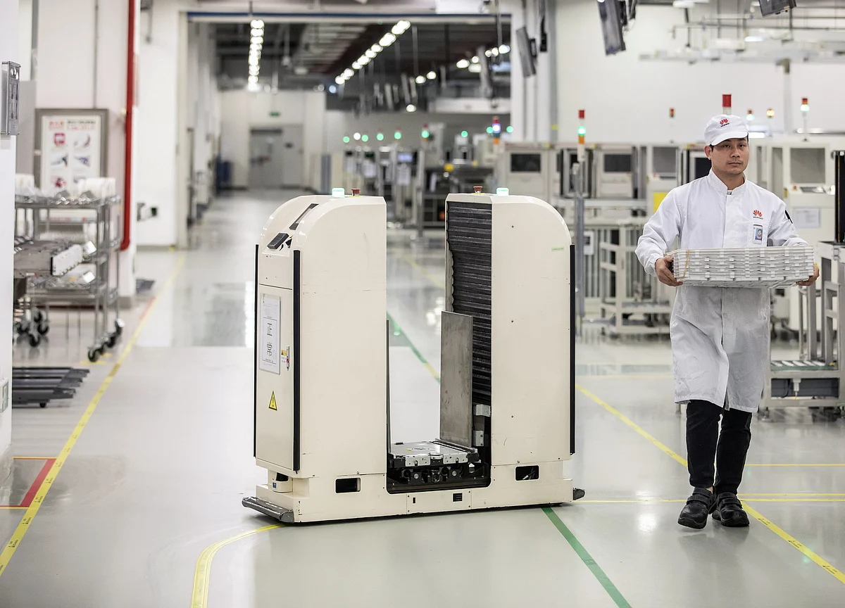 Robots Edge Closer to Unloading Trucks in Amazon-Era Milestone