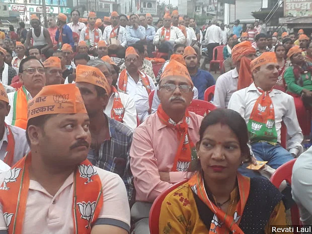 Supporters of the BJP sport the party’s campaign material at a rally in Hardoi town addressed by Prime Minister Narendra Modi and the party’s candidate for Misrikh constituency Ashok Rawat.