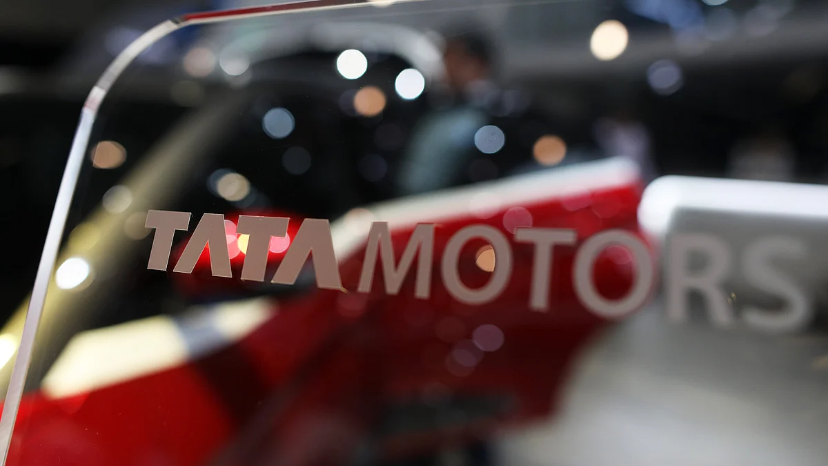 <div class="paragraphs"><p>A Tata Motors Ltd. logo sits on glass on the company’s stand (Photographer: Chris Ratcliffe/Bloomberg)</p></div>