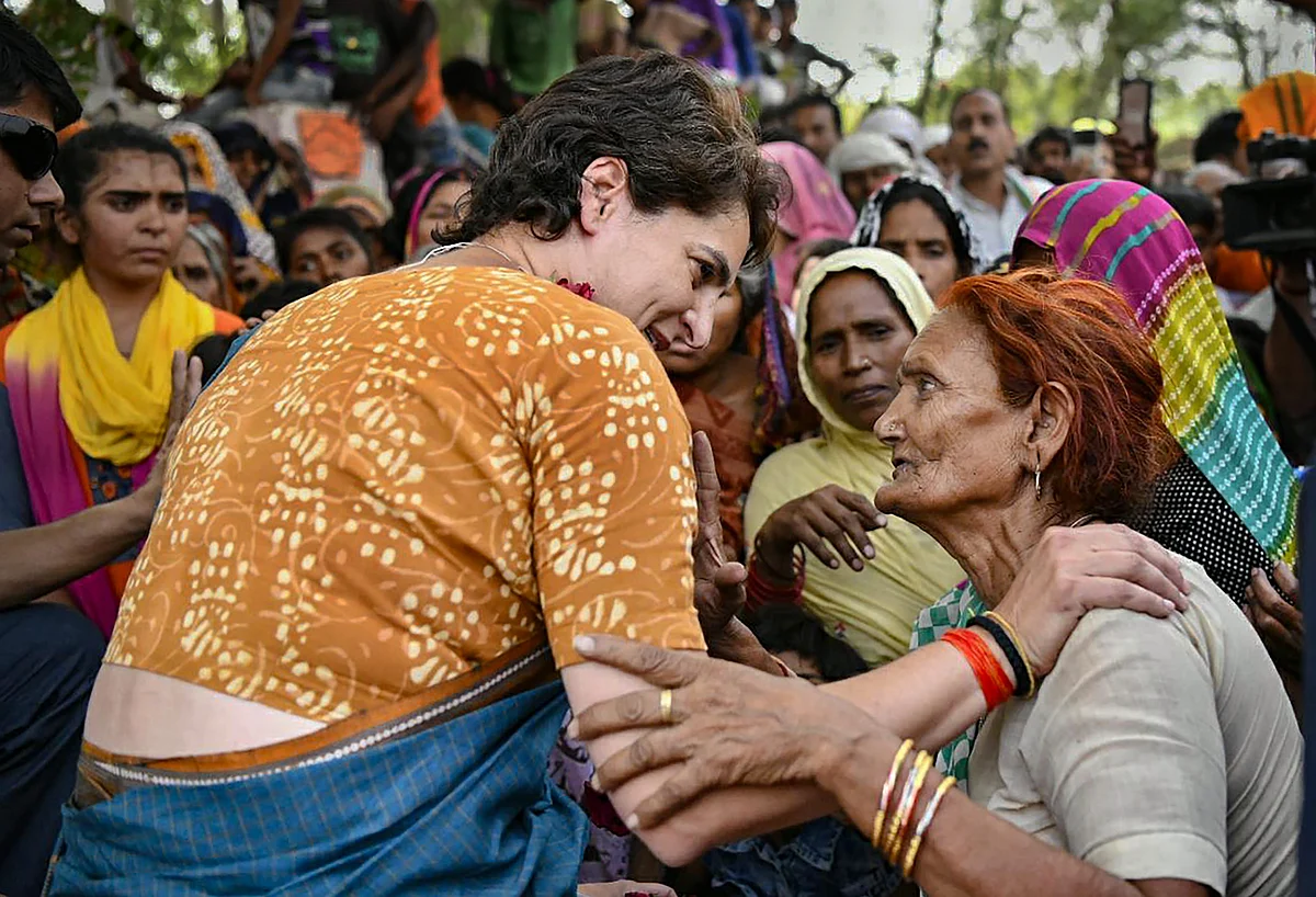 Priyanka Gandhi meets villagers while campaigning in Uttar Pradesh. (Source: PTI)