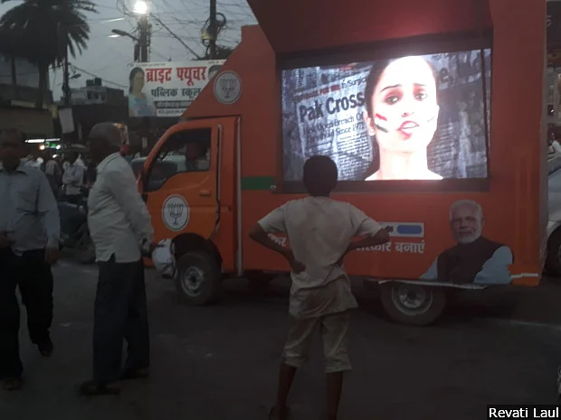 A screen mounted on a carrier plays campaign videos of the Bharatiya Janata Party in Lucknow. The constituency has unfailing voted for the Bharatiya Janata Party since 1991.