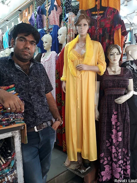 Himanshu Khanchandani’s Jeewan Stores sells nighties for women along the ghats in Varanasi. A Modi fan, he has no time for claims that demonetisation and the goods and services tax hit small businesses like his. Outside the frame, other shopkeepers say “Modinomics” hit them hard.