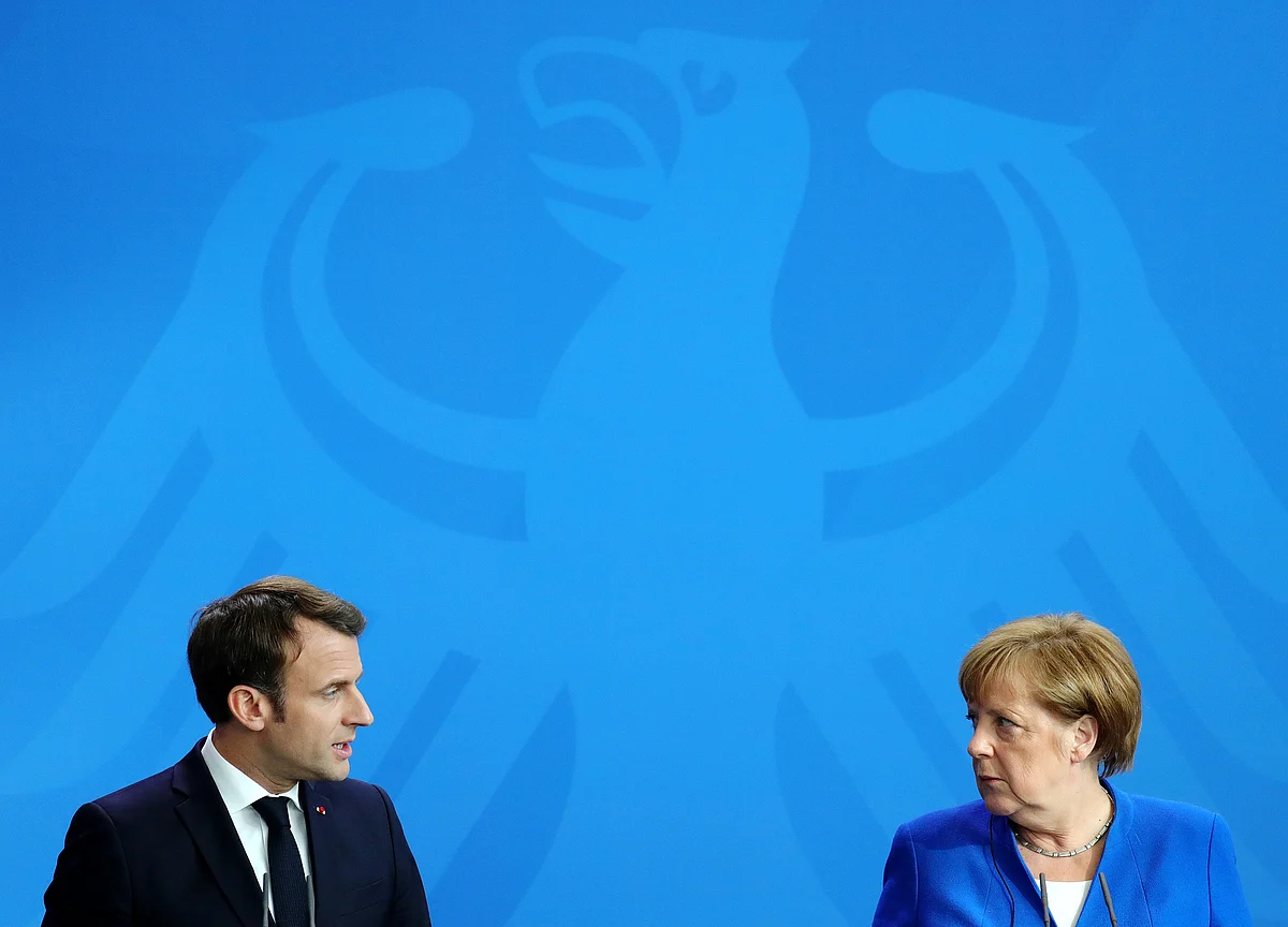 Macron and Merkel at Odds Over EU Jobs, Decision Due End of June