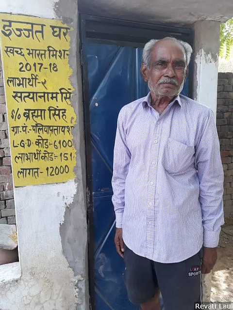 Ram Tirath, 55, stands next to the toilet he built with the assistance of the government’s Swachh Bharat scheme, at his home in Palia Pratap Shah in the western Uttar Pradesh district of Faizabad. There is no question of voting for anyone besides the Bharatiya Janata Party and Prime Minister Narendra Modi, he says.