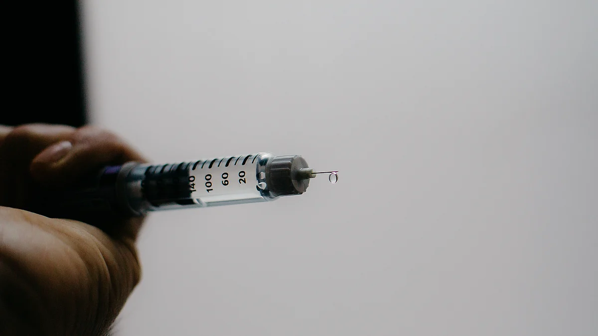 A person tests the flow of a Sanofi Lantus brand SoloStar insulin pen in an arranged photograph taken in the Brooklyn borough of New York, U.S. (Photographer: Alex Flynn/Bloomberg)