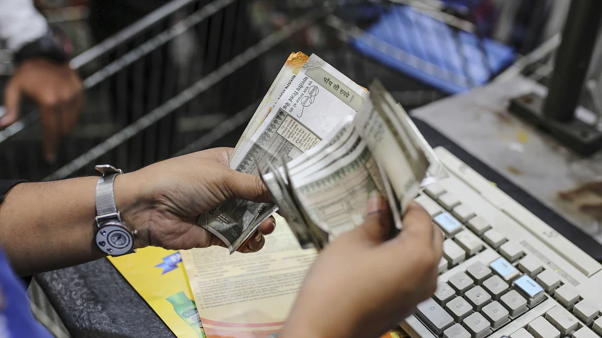 An employee counts Indian rupee banknotes at a Walmart Inc. Best Price Modern Wholesale store in Hyderabad. (Photographer: Dhiraj Singh/Bloomberg)