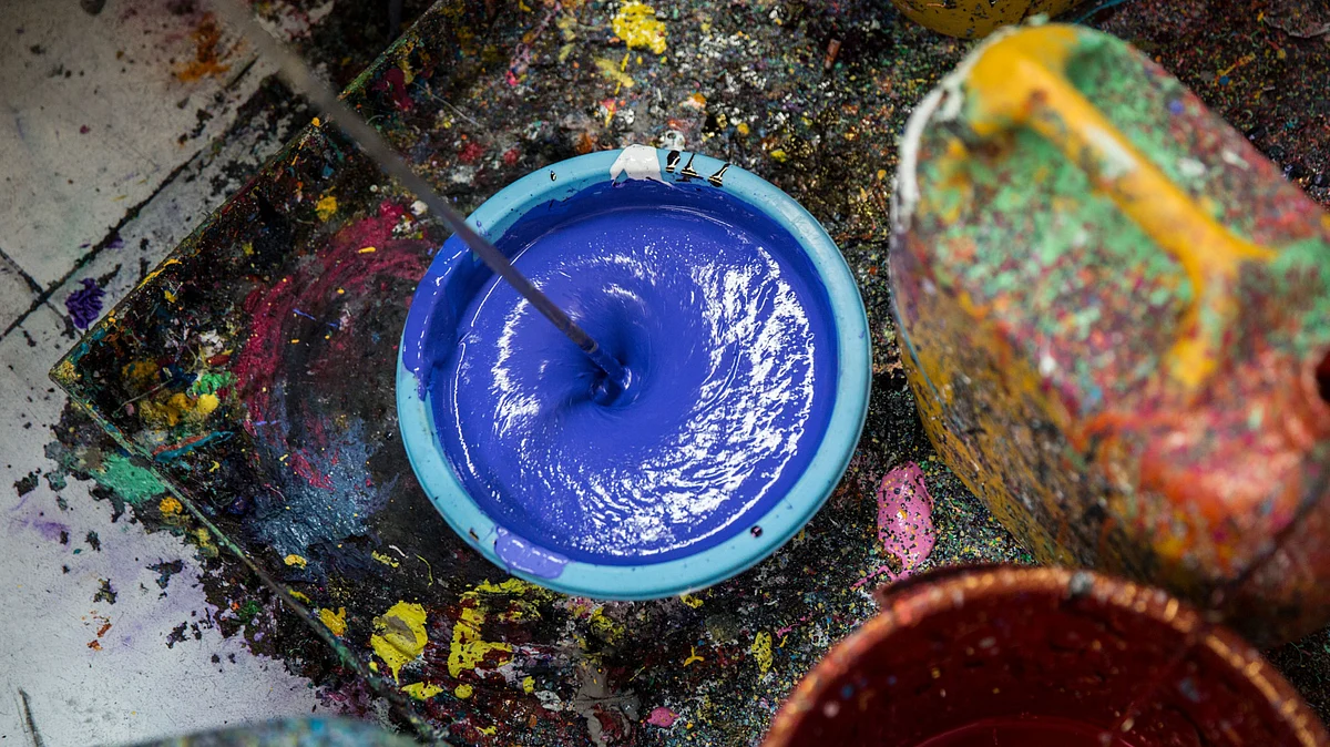 A employee, not pictured, prepares screen printing fabric ink in Kolkata, West Bengal, India. (Photographer: Taylor Weidman/Bloomberg)