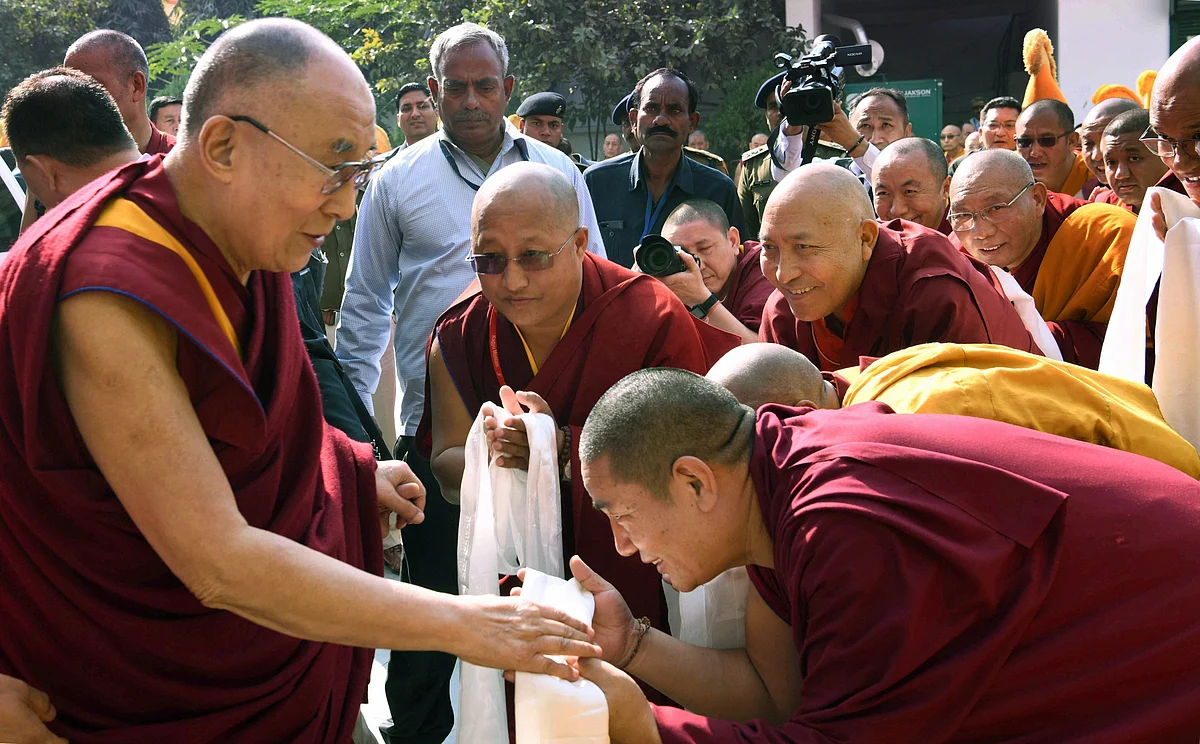The Dalai Lama blesses a devotee as he arrives at a Tibetan Temple in Bodh Gaya, on Dec. 16, 2018. (Photograph: PTI)