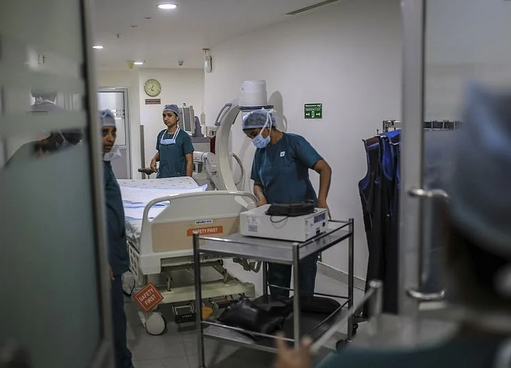 Apollo Hospitals Mull Passing on New India Tax Cut to Investors