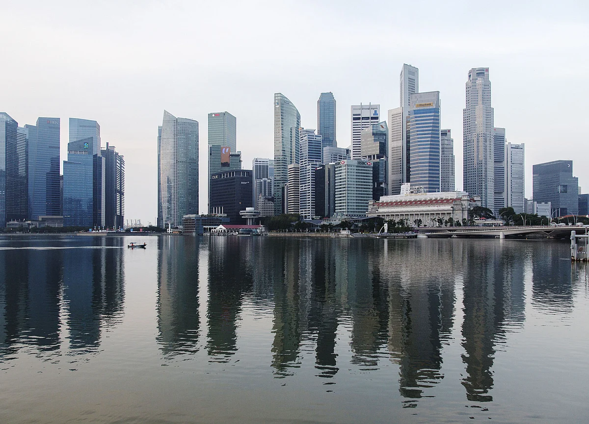 Singapore Dollar Seen Sliding as Central Bank Faces Downturn