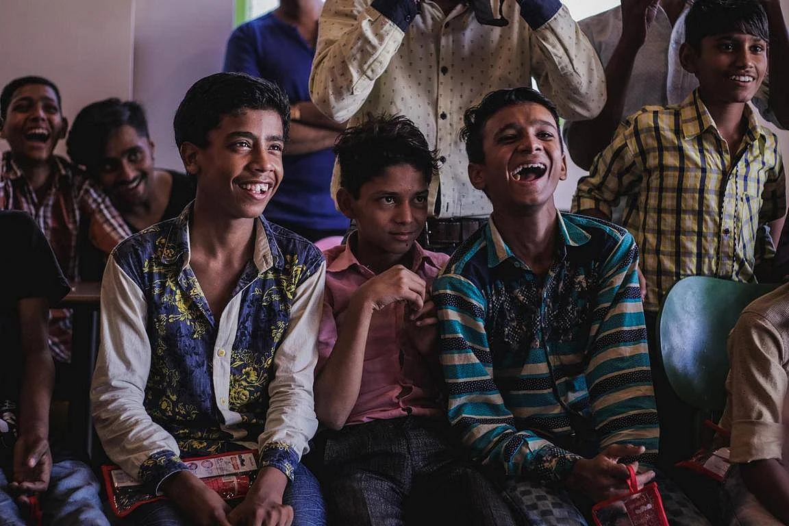 Volunteers spending time with children at a shelter home in Delhi. (Photograph: Make A Difference)