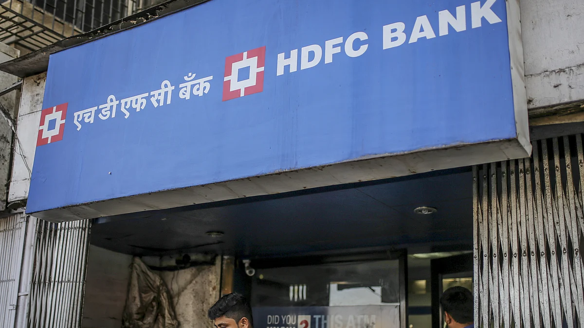 A customer exits an HDFC Bank Ltd. branch in Mumbai. (Photographer: Dhiraj Singh/Bloomberg) 