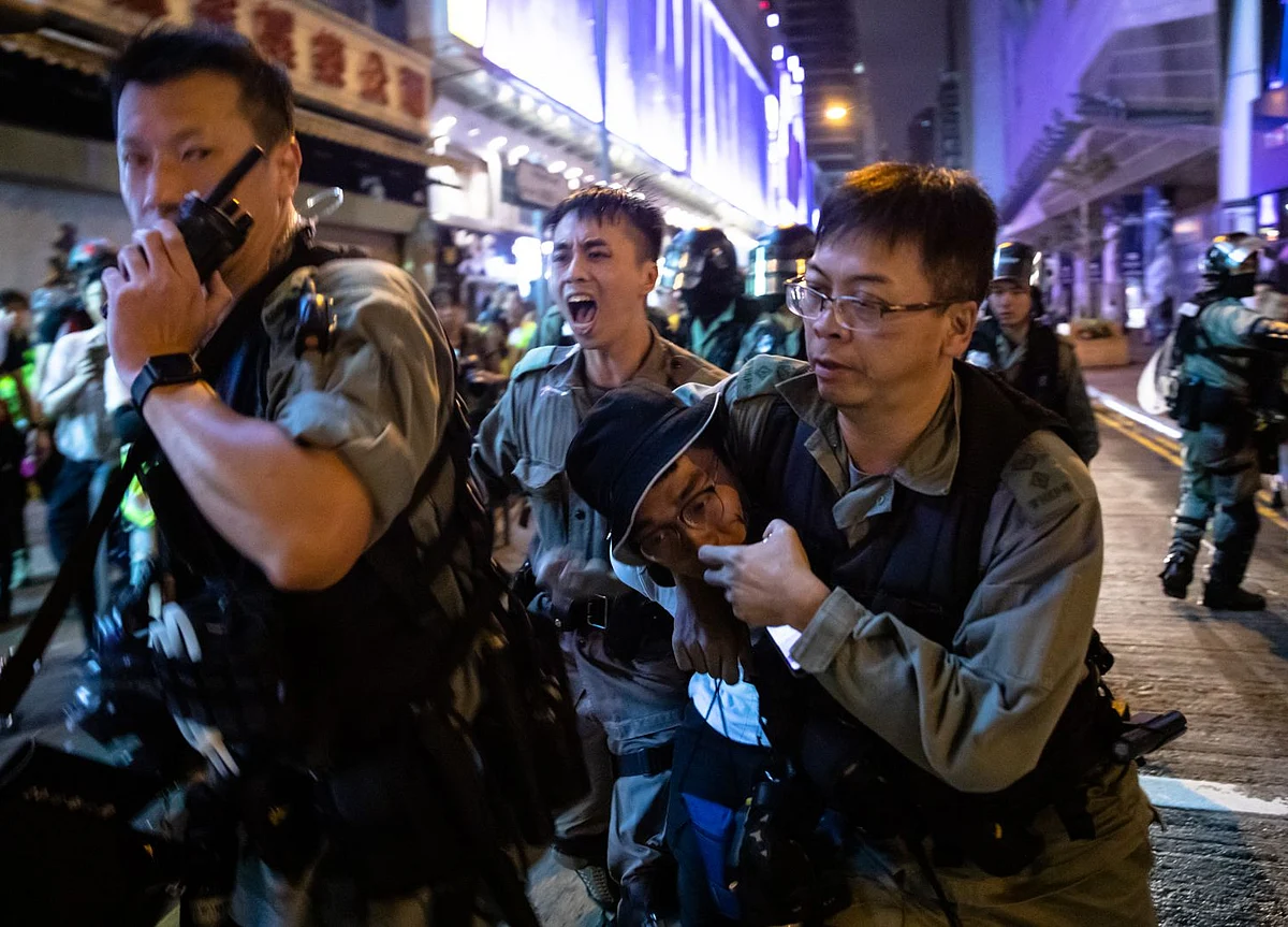 Hong Kong Police Officer Slashed in Neck as Violence Continues