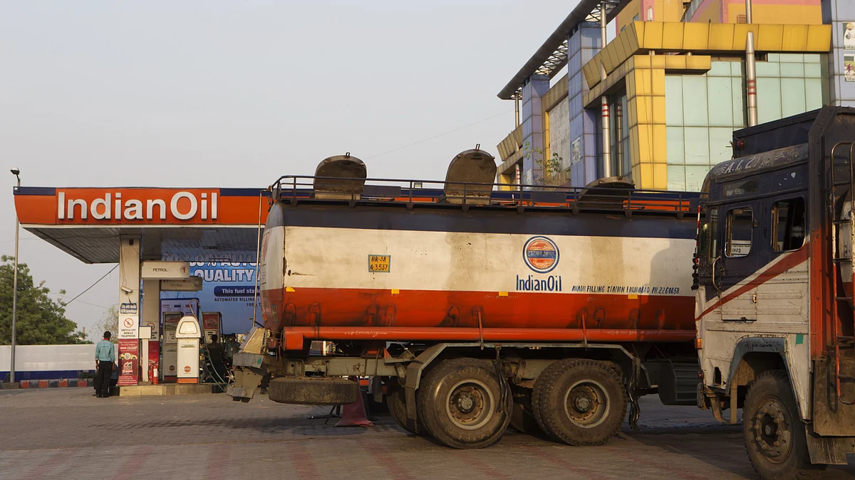 Indian Oil Corp. tanker trucks sit parked at one of the company’s gas stations near the Delhi city boundary in Faridabad, Haryana, India. (Photographer: Prashanth Vishwanathan/Bloomberg)