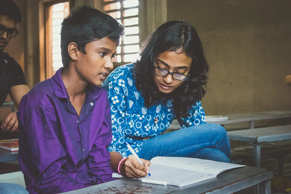 A volunteer and child at an education support class in Hyderabad. (Photograph: Make A Difference)