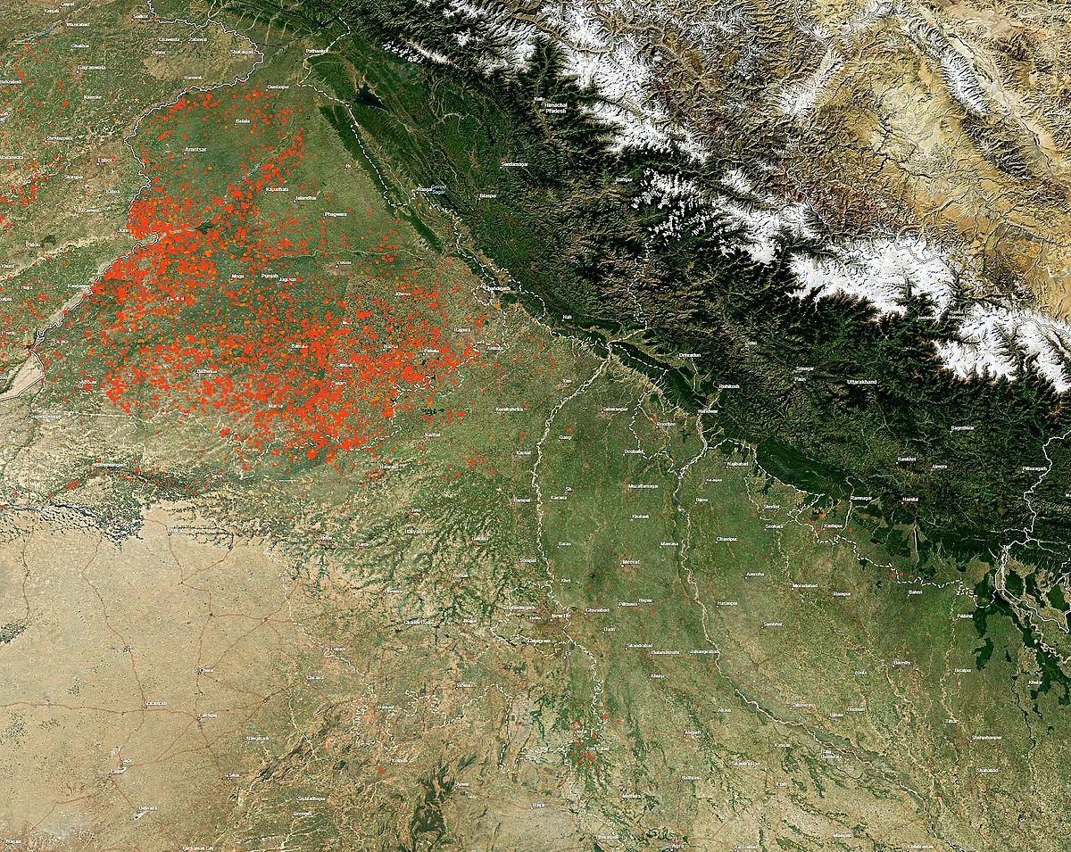 NASA image released on Wednesday afternoon showing red dots indicating fires, including those due to stubble burning, in areas surrounding Delhi and rest of North India. (Source: PTI)