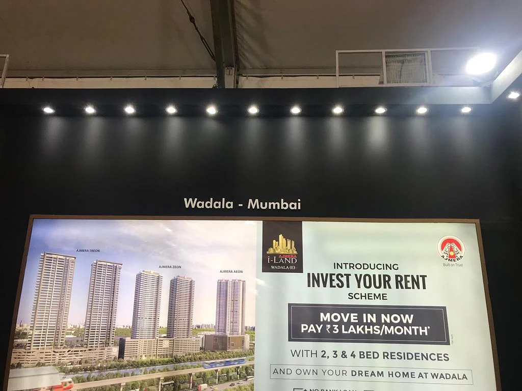 A hoarding advertising Ajmera Realty’s Invest You Rent Scheme at the property expo (Source: BloombergQuint)