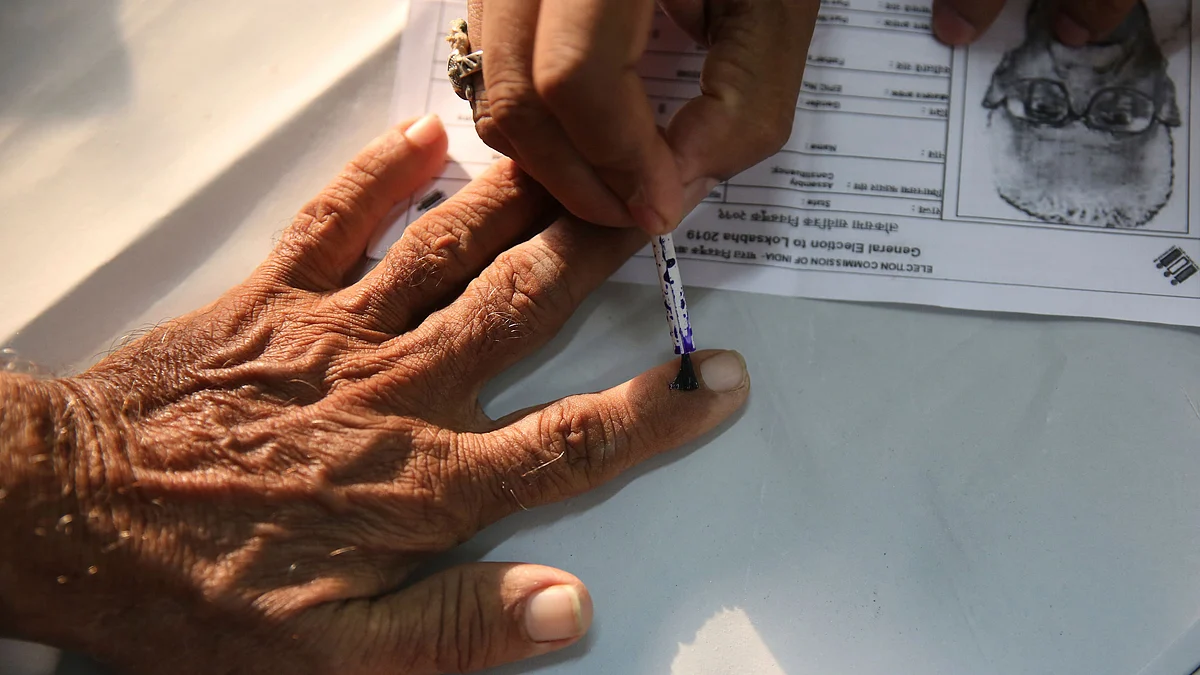 File photo of an elderly citizen getting ink mark on his finger prior to voting. Used for representation.