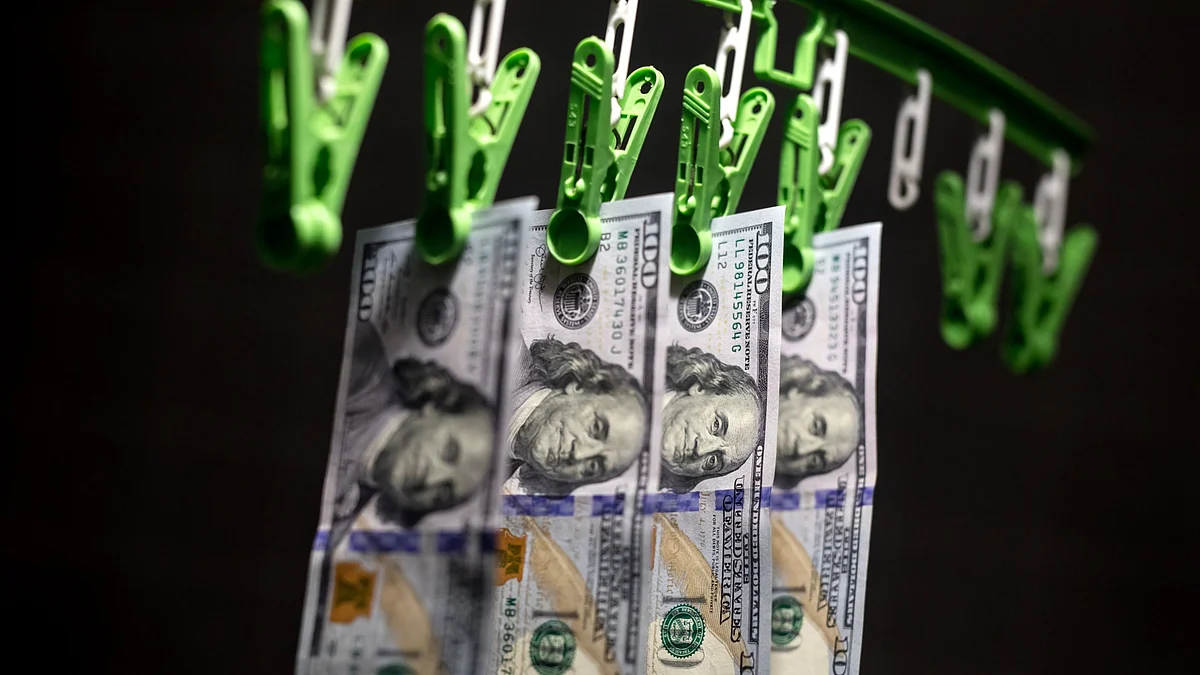 U.S. one-hundred dollar banknotes are arranged for a photograph in Hong Kong, China. (Photographer: Paul Yeung/Bloomberg)