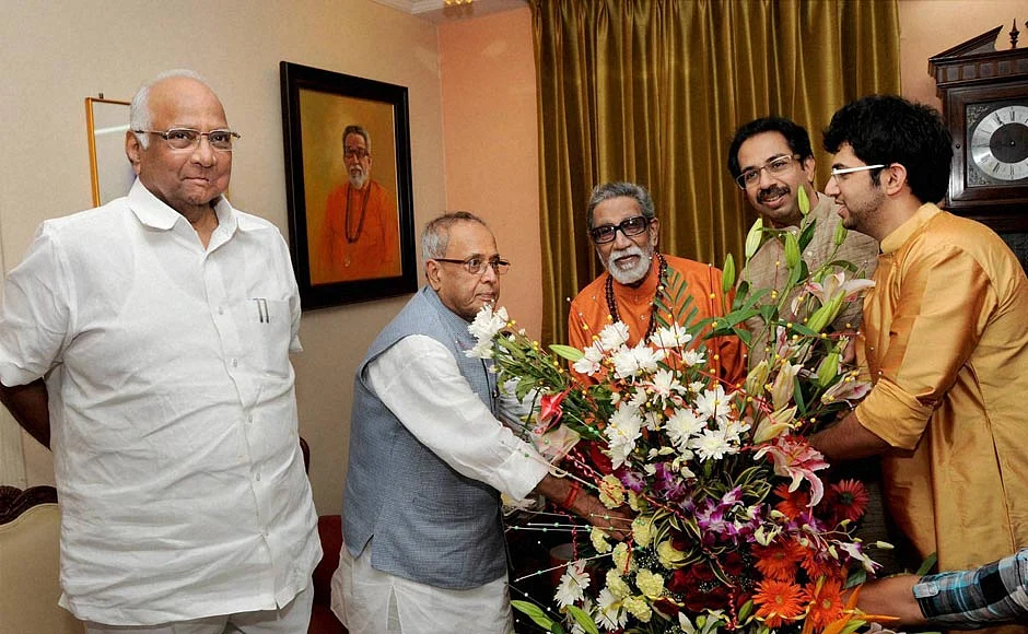 Sharad Pawar and Pranab Mukherjee, with the Thackeray family, in Mumbai, on July 13, 2012. (Photograph: PTI File Photo)