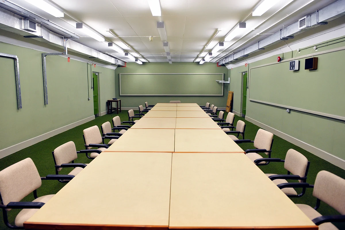Chairs surround a table in the conference room inside a former nuclear bunker. (Photographer: Aidan Crawley/Bloomberg)