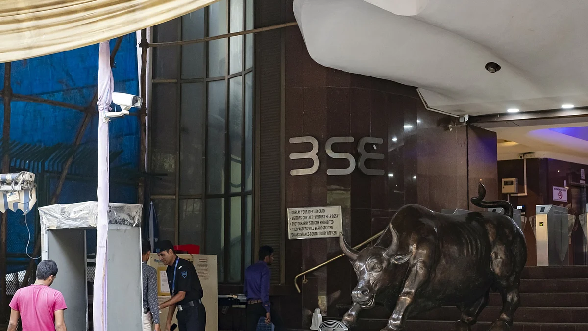 People walk through a metal detector at a security check-point at the Bombay Stock Exchange (BSE) building in Mumbai, India, on Wednesday, Oct. 16, 2019. (Photographer: Kanishka Sonthalia/Bloomberg)