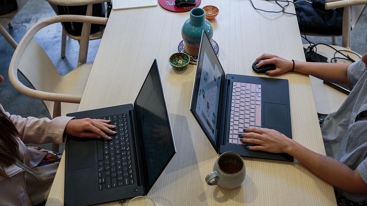 People working on laptop computers. (Photographer: Sarah Blesener/Bloomberg)