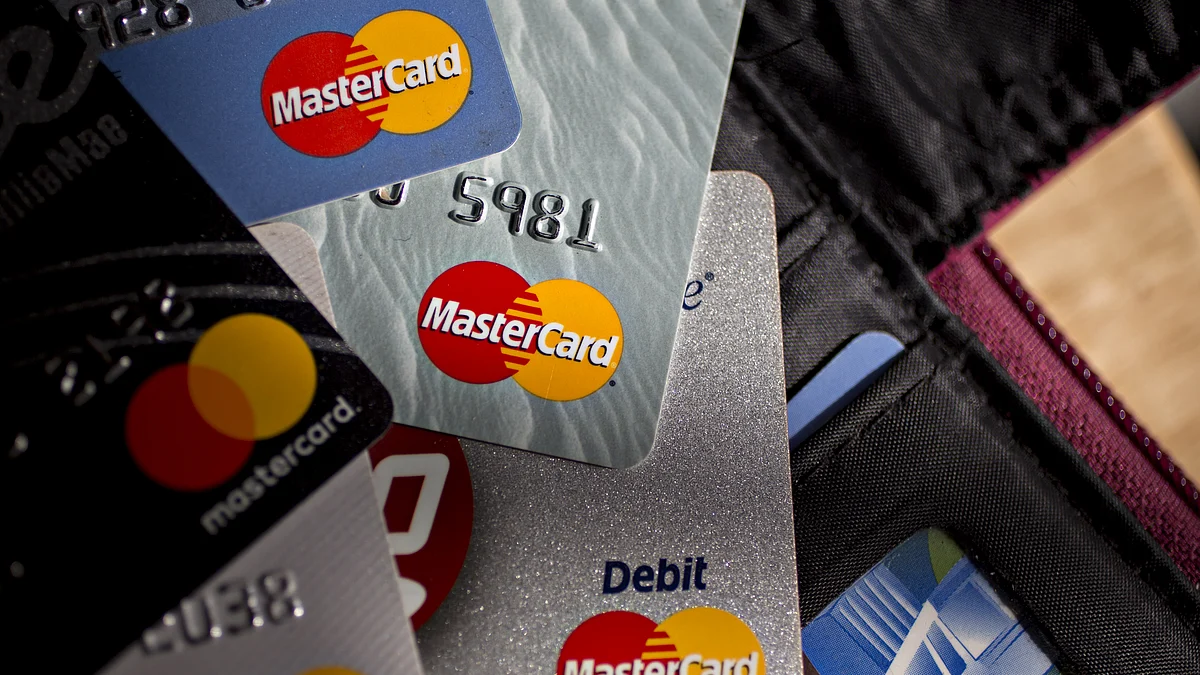 Mastercard Inc. credit and debit cards are arranged for a photograph. (Photographer: Andrew Harrer/Bloomberg) 