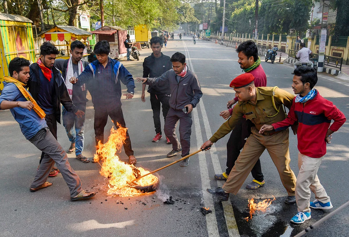 Demonstrators burn tyres during a strike in Guwahati (Source: PTI)