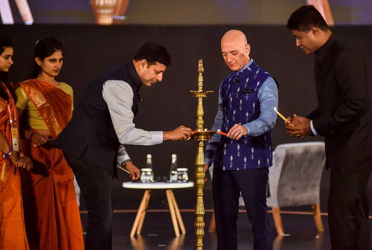 Amazon CEO Jeff Bezos lights the ceremonial lamp with Amazon Global Senior Vice President Amit Agarwal during Amazon SMBhav event in New Delhi, India, on Wednesday, Jan. 15, 2020. (Photo: PTI)