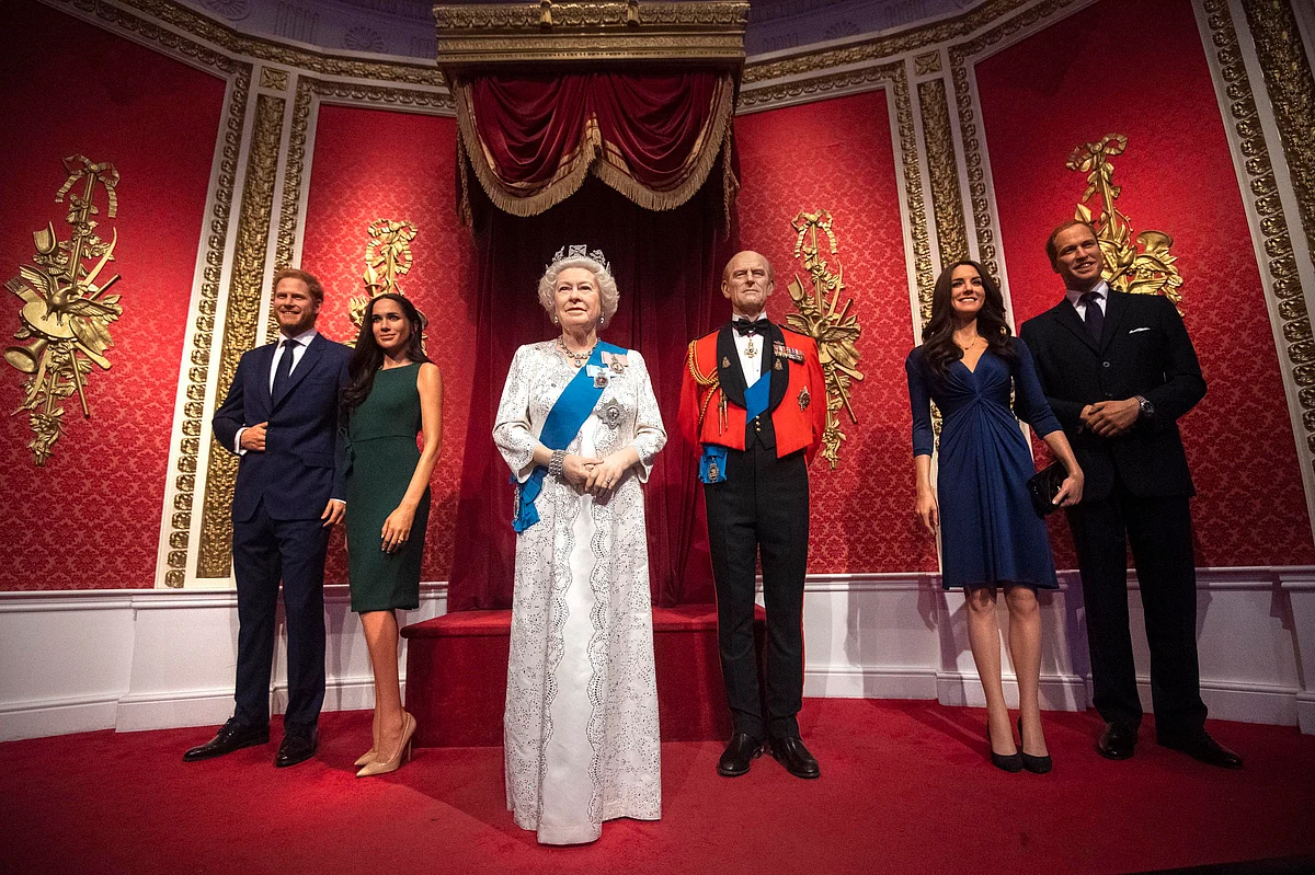 The figures of Britain’s Prince Harry and Meghan, Duchess of Sussex, left, in their original positions next to Queen Elizabeth II, Prince Philip and Prince William and Kate, Duchess of Cambridge, at Madame Tussauds in London, Thursday Jan. 9, 2020. (AP Via PTI) 