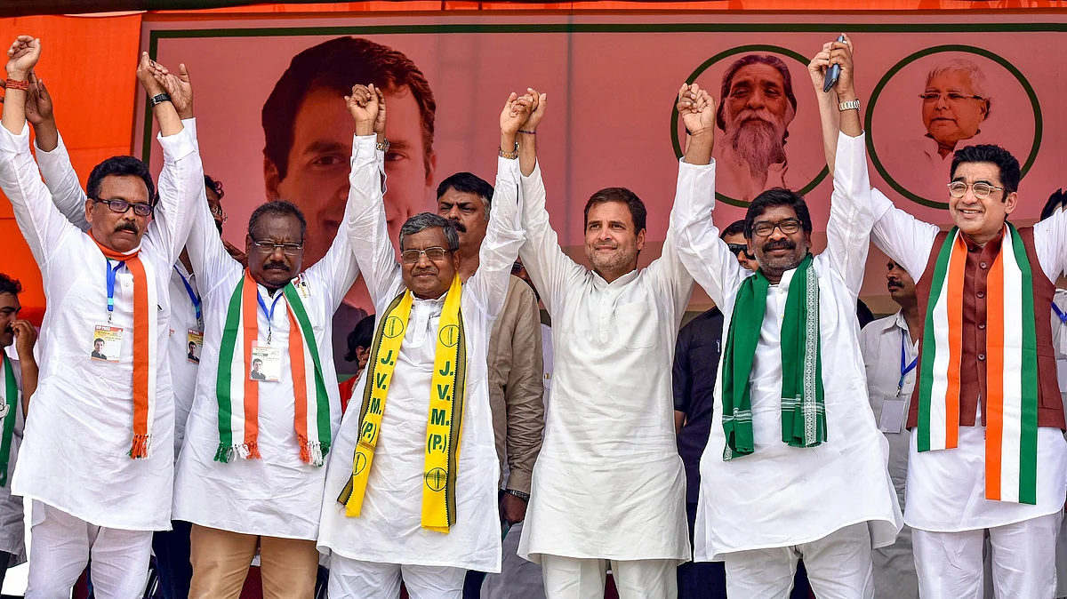 Rahul Gandhi with Babulal Marandi and Hemant Soren in Simdega, Jharkhand. (Photograph: PTI) 