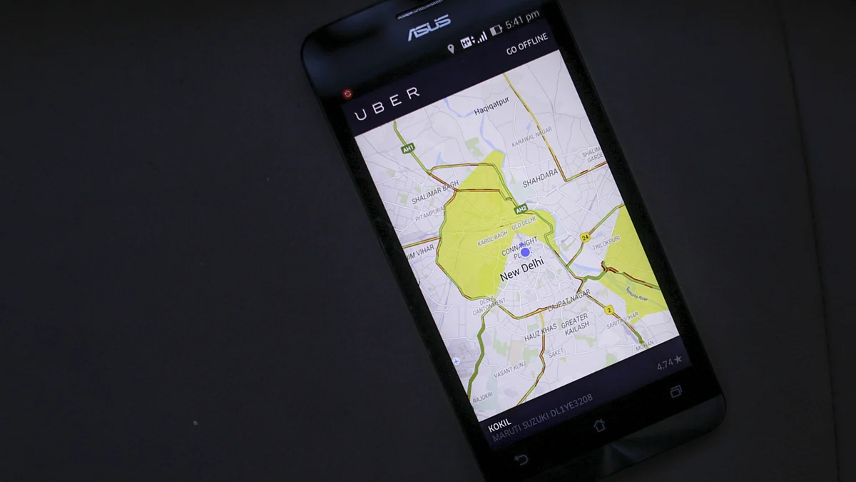 The Uber application displays a map of New Delhi a phone in New Delhi. (Photographer: Dhiraj Singh/Bloomberg)