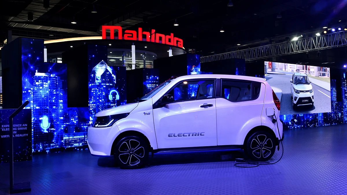 The Mahindra & Mahindra Ltd. E20 electic vehicle (EV) stands on display at the Auto Expo 2018 held in Noida, Uttar Pradesh, India. (Photographer: Anindito Mukherjee/Bloomberg)