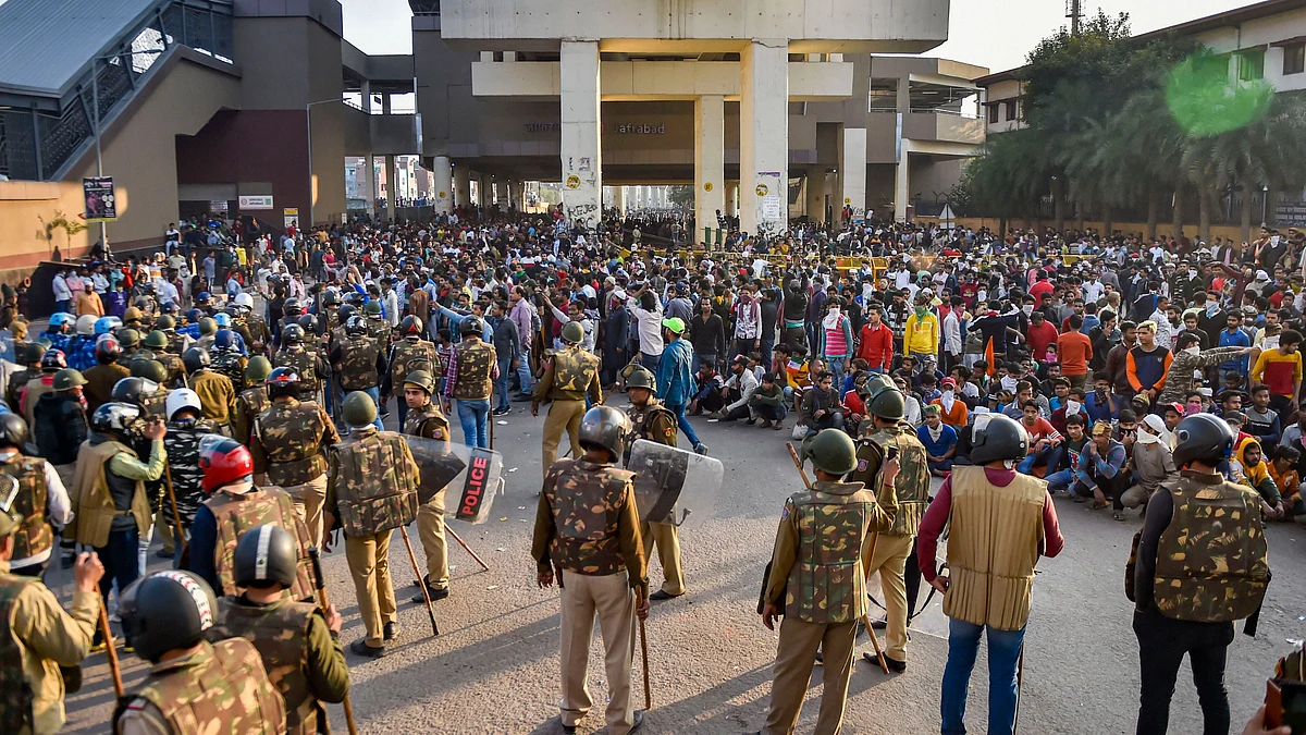 Security personnel stand guard during clashes between those supporting and against the Citizenship (Amendment) Act in northeast Delhi. (Source: PTI)